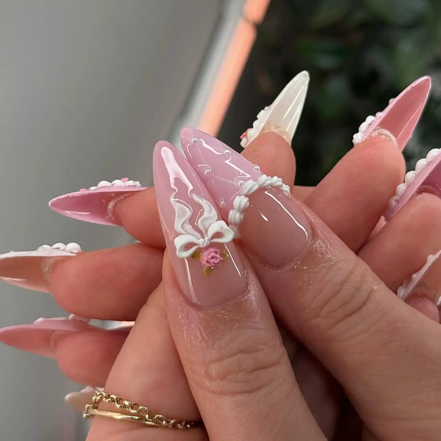 Handmade 3D blush pink and white press-on nails with floral and ribbon designs