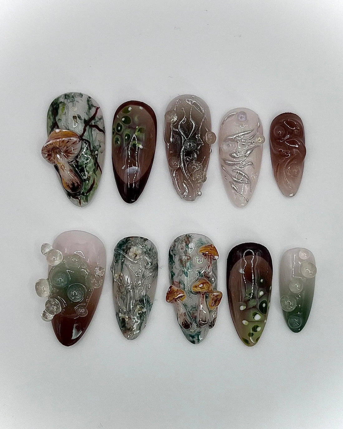 Handmade press-on nails with 3D mushroom, moss, and earth tone goblincore designs