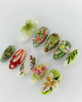 Handmade 3D press-on nails with tropical orchid, lily, and green floral designs