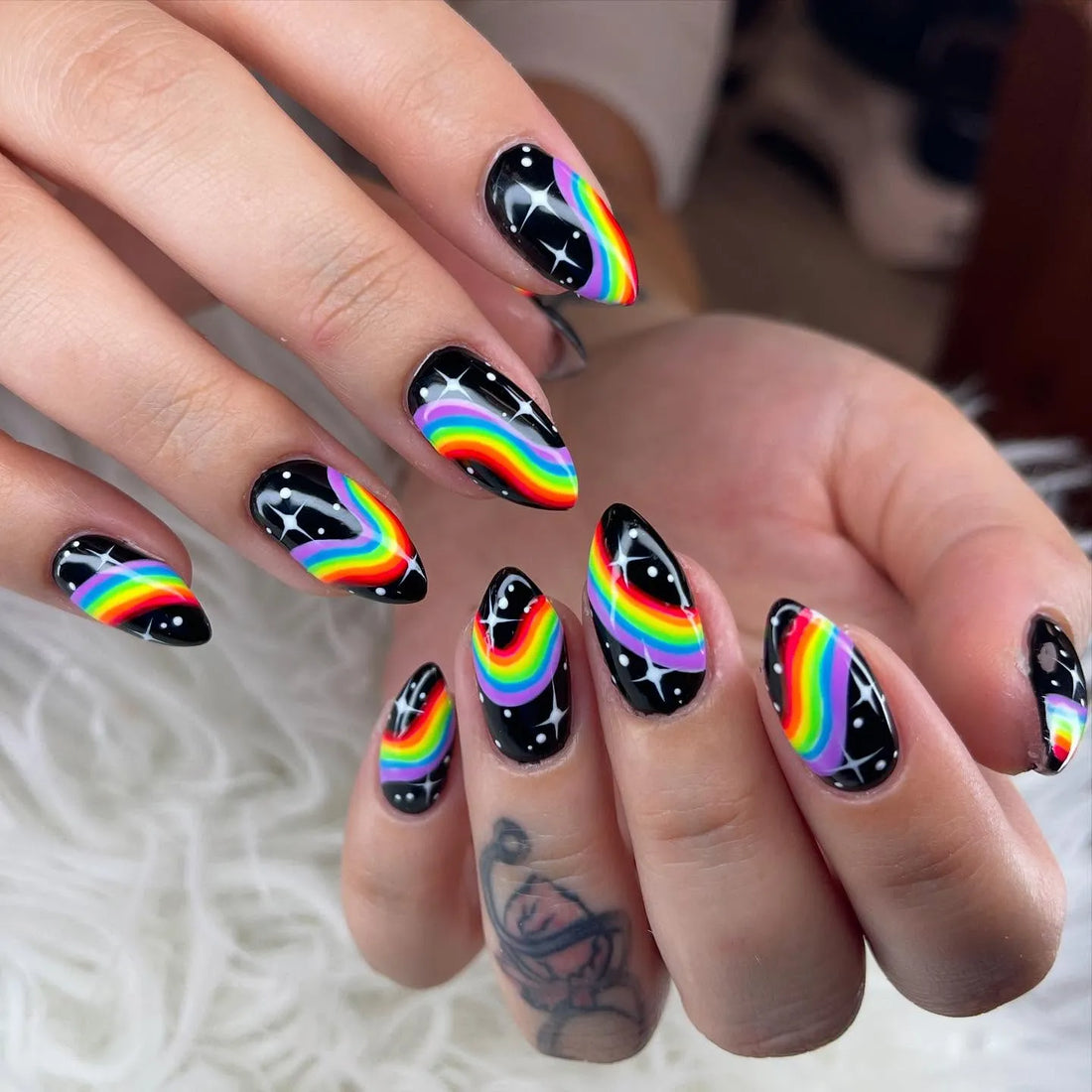 Handmade black press-on nails with rainbow galaxy and starry space design