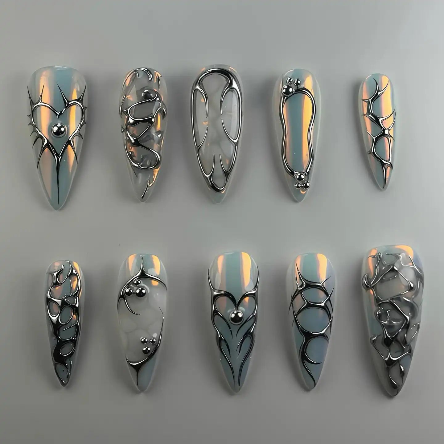 Handmade chrome silver 3D heart abstract metallic press-on nails with futuristic designs