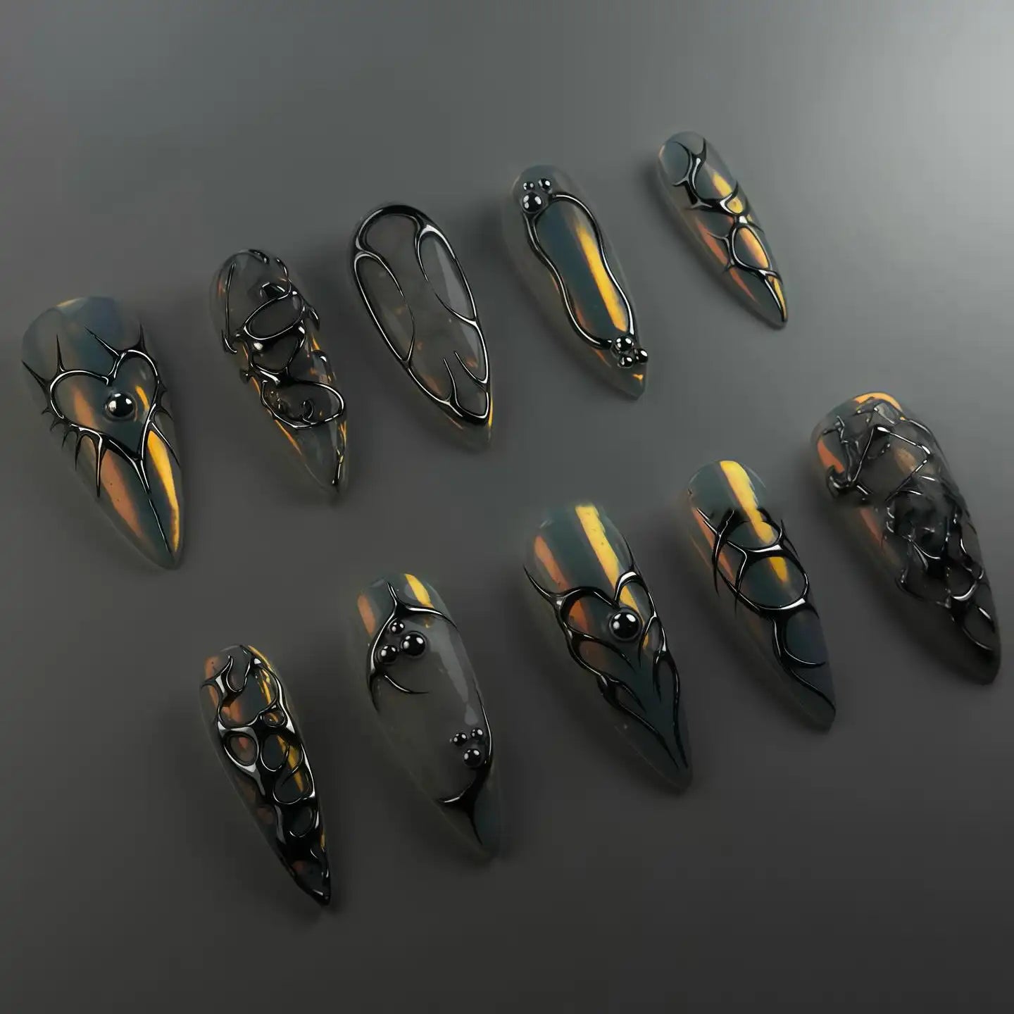 Handmade chrome silver 3D heart abstract metallic press-on nails on gray background