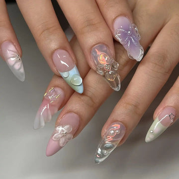 Handmade clear spring press-on nails with 3D blossom and butterfly designs, pastel accents