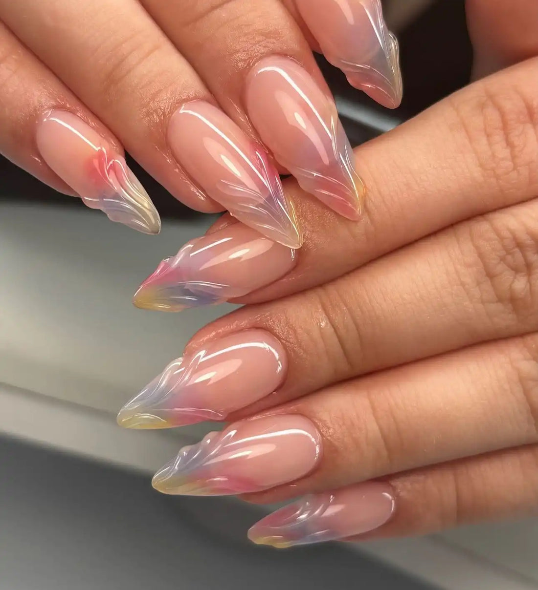 Handmade colorful 3D French press-on nails with glossy, sculpted stiletto tips