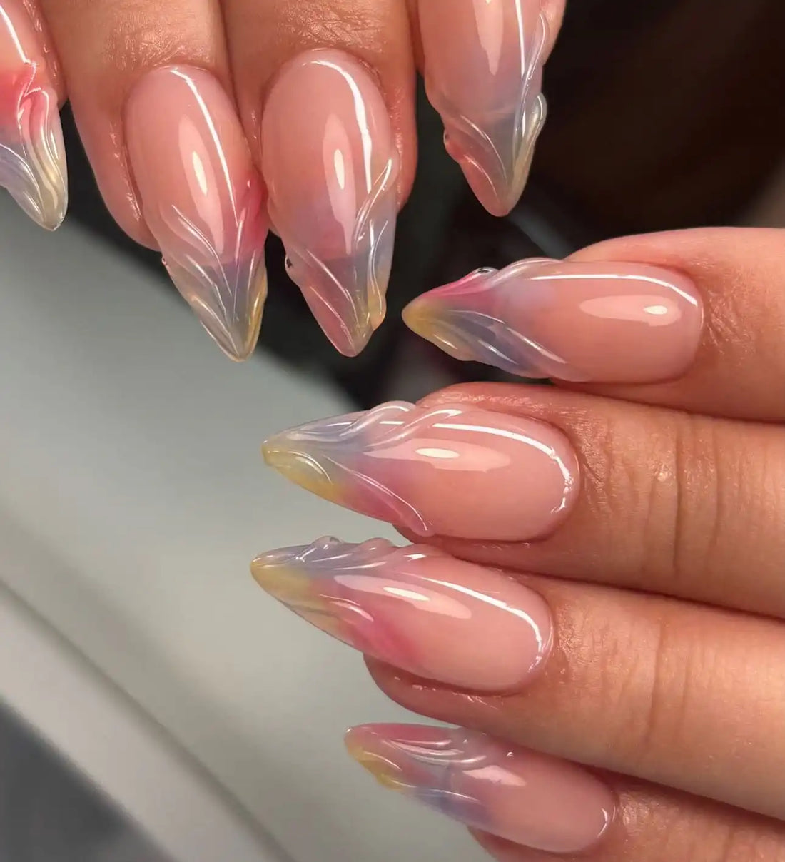 Handmade colorful 3D French press-on nails with glossy, sculpted stiletto tips