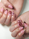 Handmade press-on nails with dark cherry French tips, floral and tiger print accents