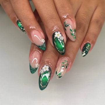 Handmade emerald green press-on nails with gold leaf accents and floral botanical designs