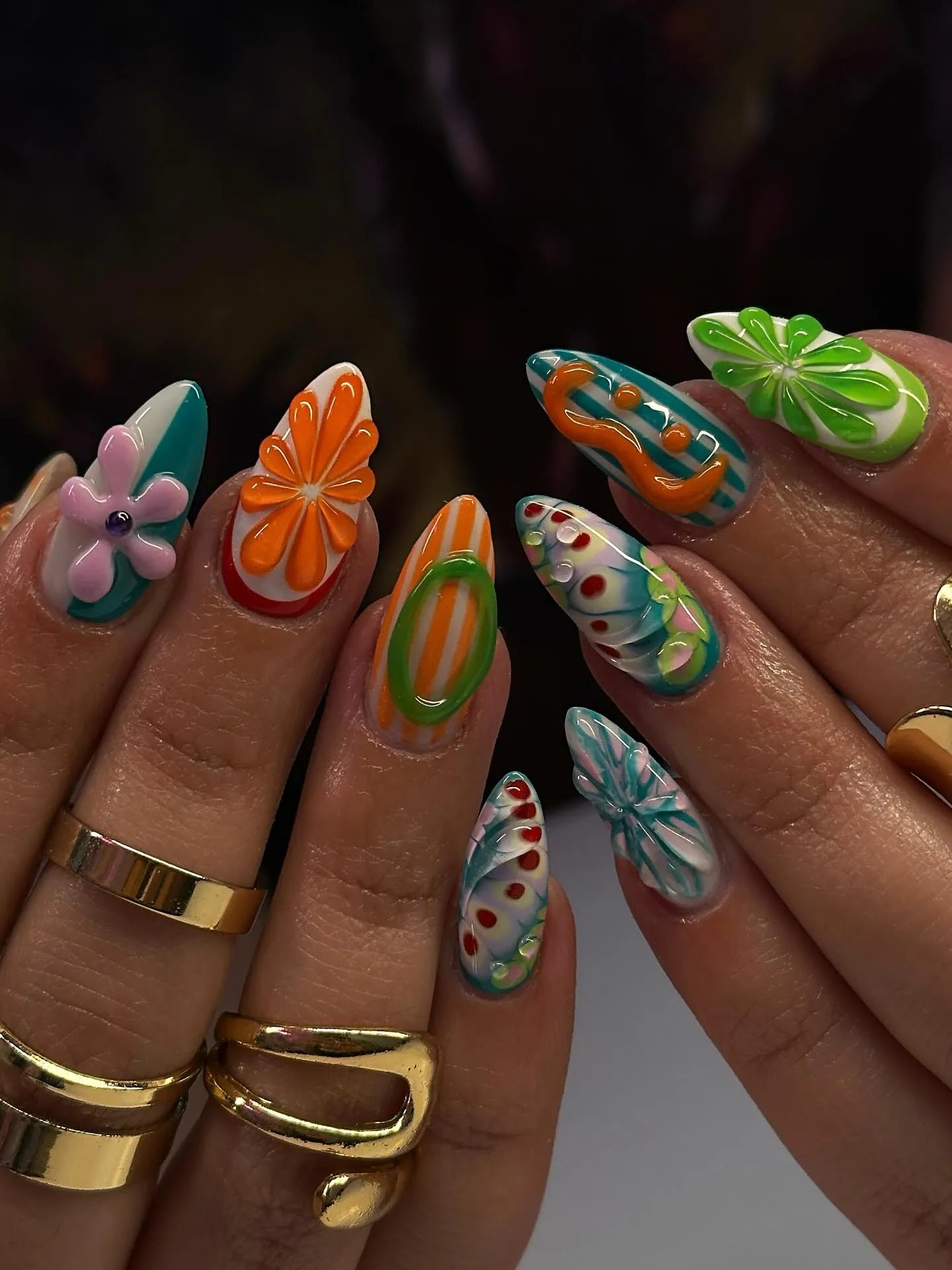 Handmade colorful abstract press-on nails with 3D floral and fruit designs, summer style.