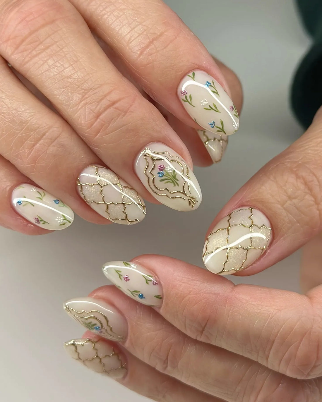 Handmade floral and gold trellis press-on nails with vintage-inspired artistic design.