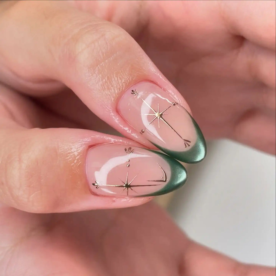 Handmade green French style press-on nails with gold star accents