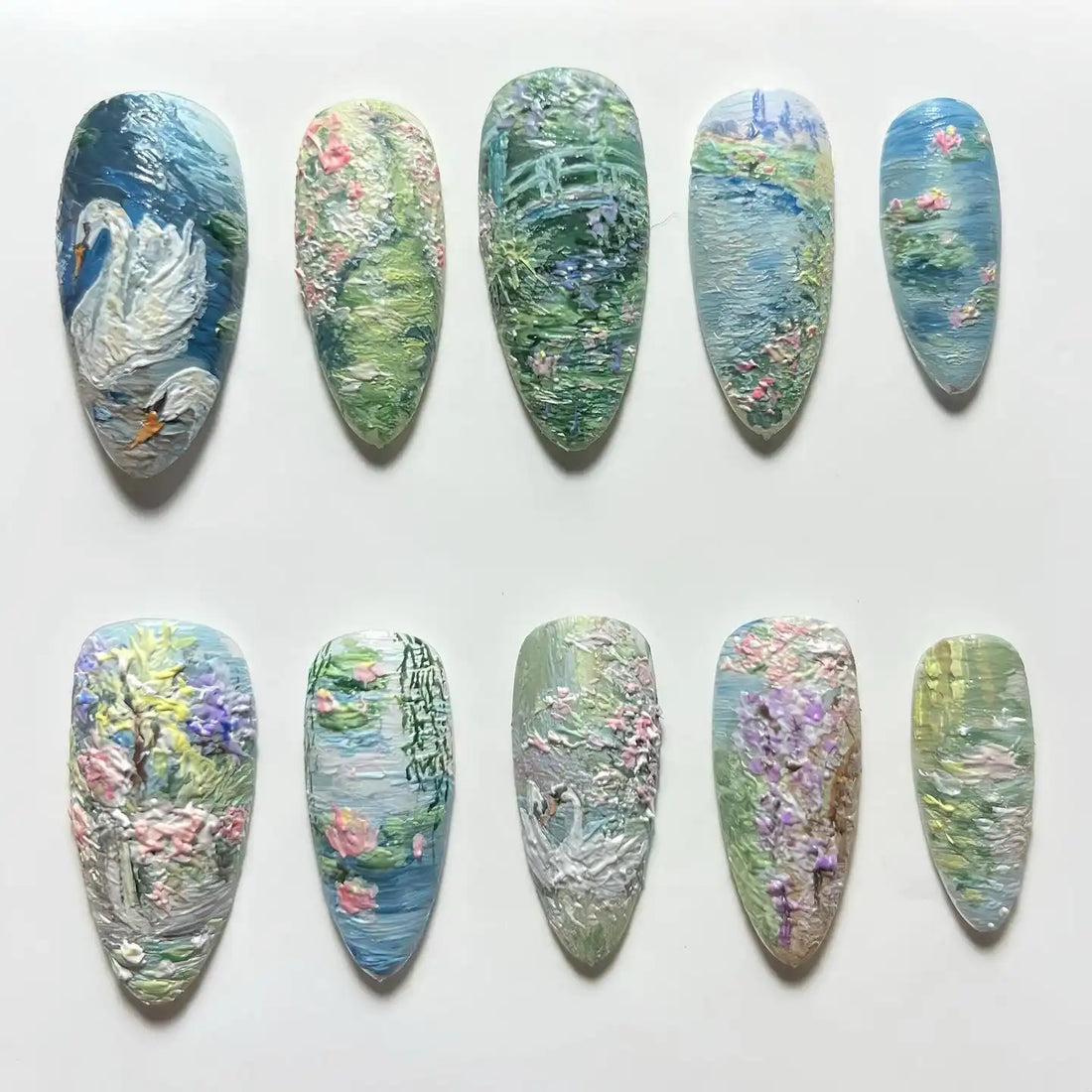 Handmade press-on nails with impressionist swan, water lily, and garden pond designs.