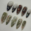 Handmade Japanese press-on nails with floral art, gold foil, pearls, and blossom designs