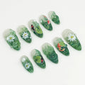 Handmade green press-on nails with 3D koi fish, lotus flowers, and nature pond designs
