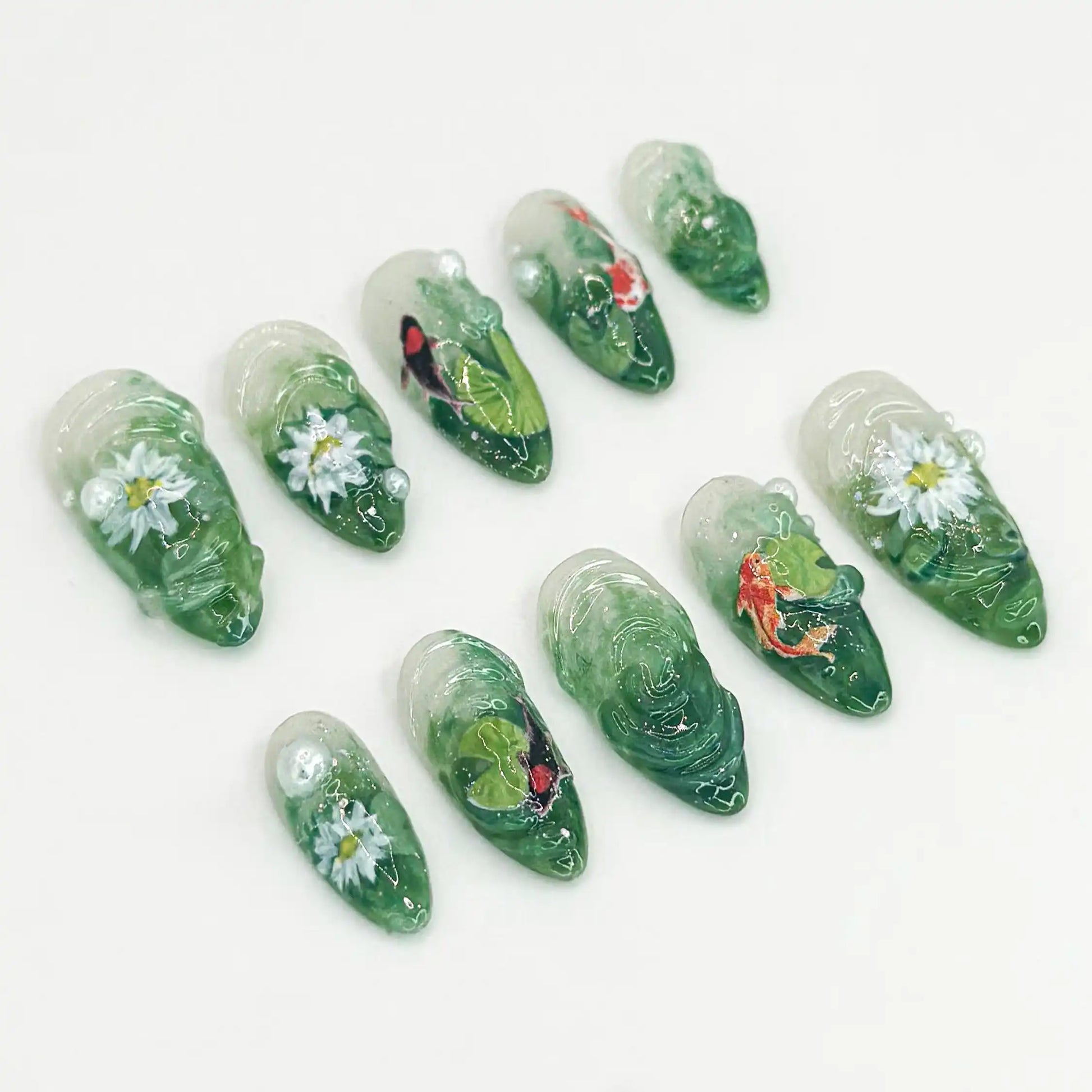 Handmade green press-on nails with 3D koi fish, lotus flowers, and nature pond designs