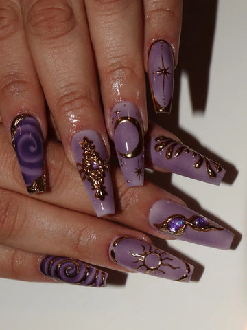 Handmade lavender press-on nails with gold celestial moon, star, and mystical designs