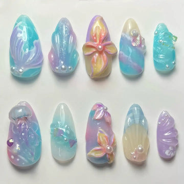 Handmade mermaid ocean press-on nails with seashell, pearl, jellyfish, and aquatic designs