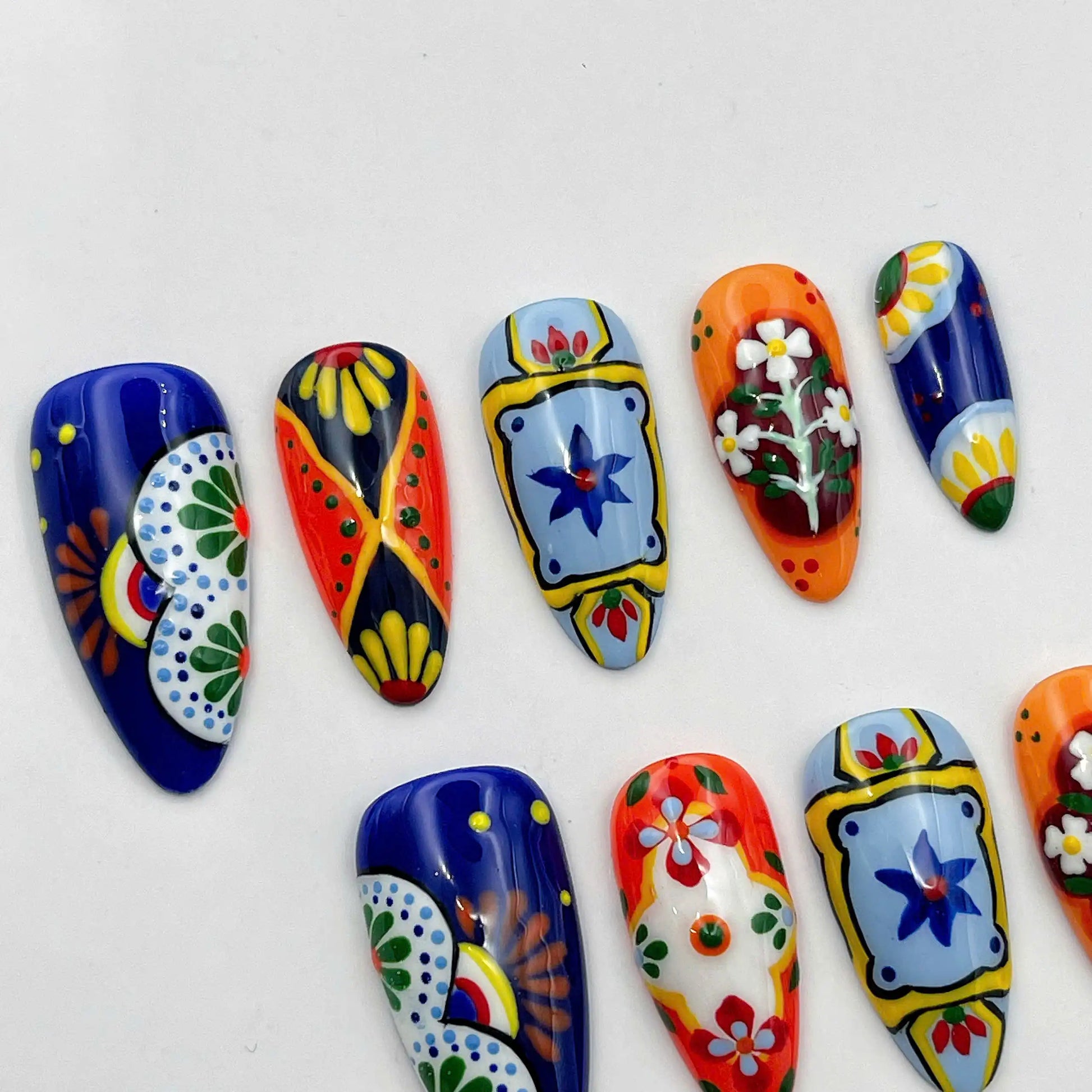 Handmade press-on nails with vibrant Mexican Talavera tile-inspired floral designs