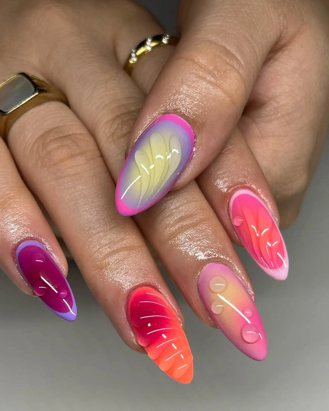 Handmade press-on nails with neon pink, orange, and purple gradient, summer beach 3D design.