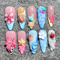 Handmade 3D ocean-themed press-on nails with flowers, seashells, turtle, and mermaid designs