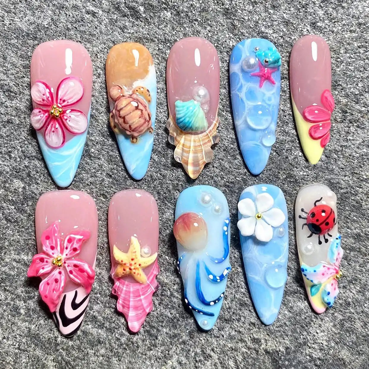Handmade 3D ocean-themed press-on nails with flowers, seashells, turtle, and mermaid designs