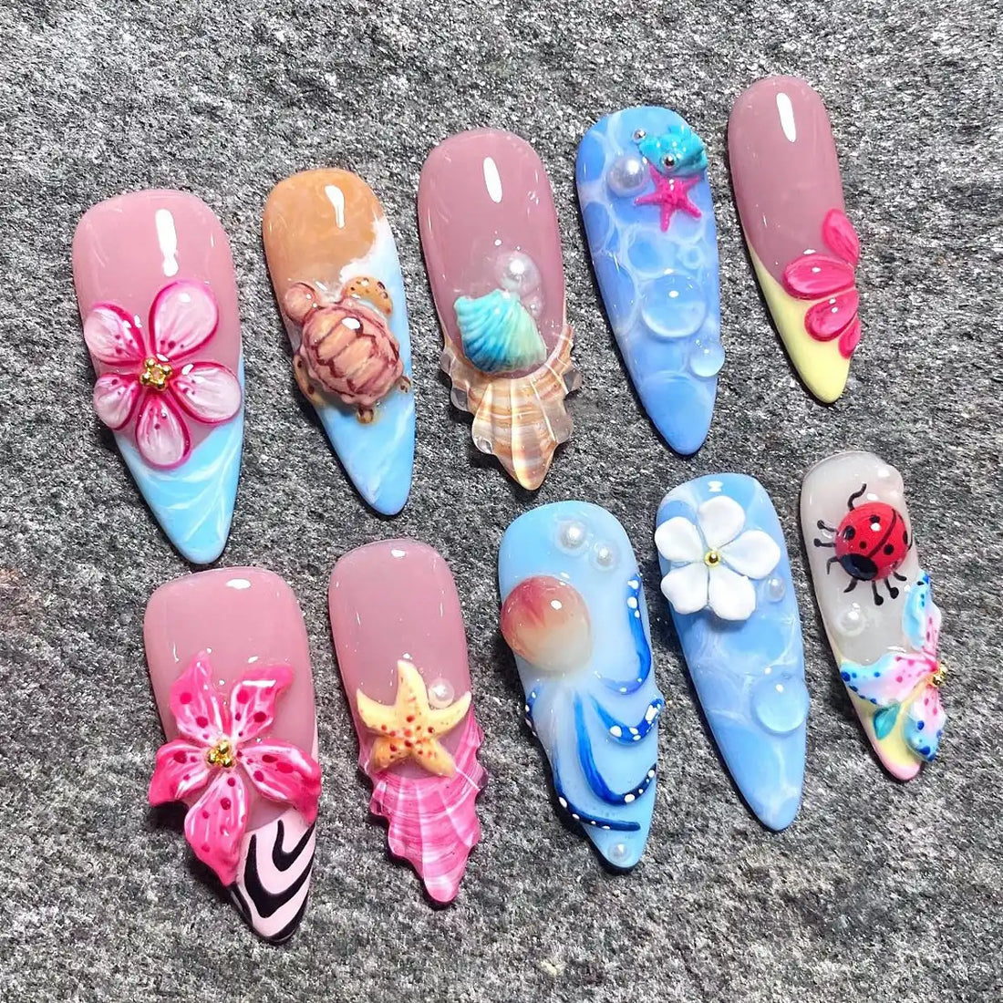 Handmade 3D ocean-themed press-on nails with flowers, seashells, turtle, and mermaid designs