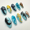 Handmade press-on nails with 3D ocean animal designs, featuring sharks, dolphins, and whales.