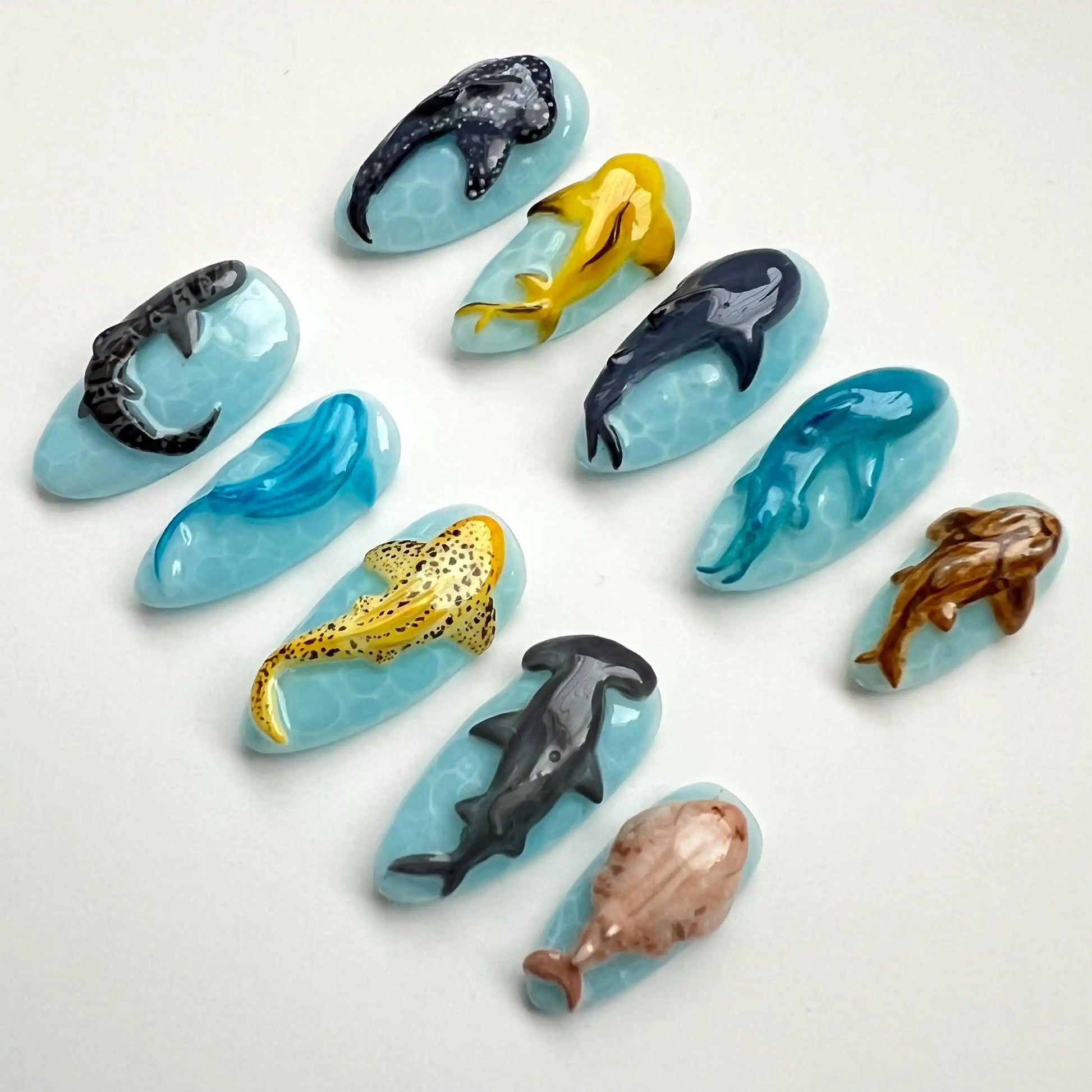 Handmade ocean animal aquarium press-on nails featuring sharks, dolphins, and whales.