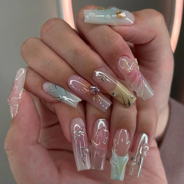 Handmade pastel chrome press-on nails with 3D floral designs and rhinestone accents