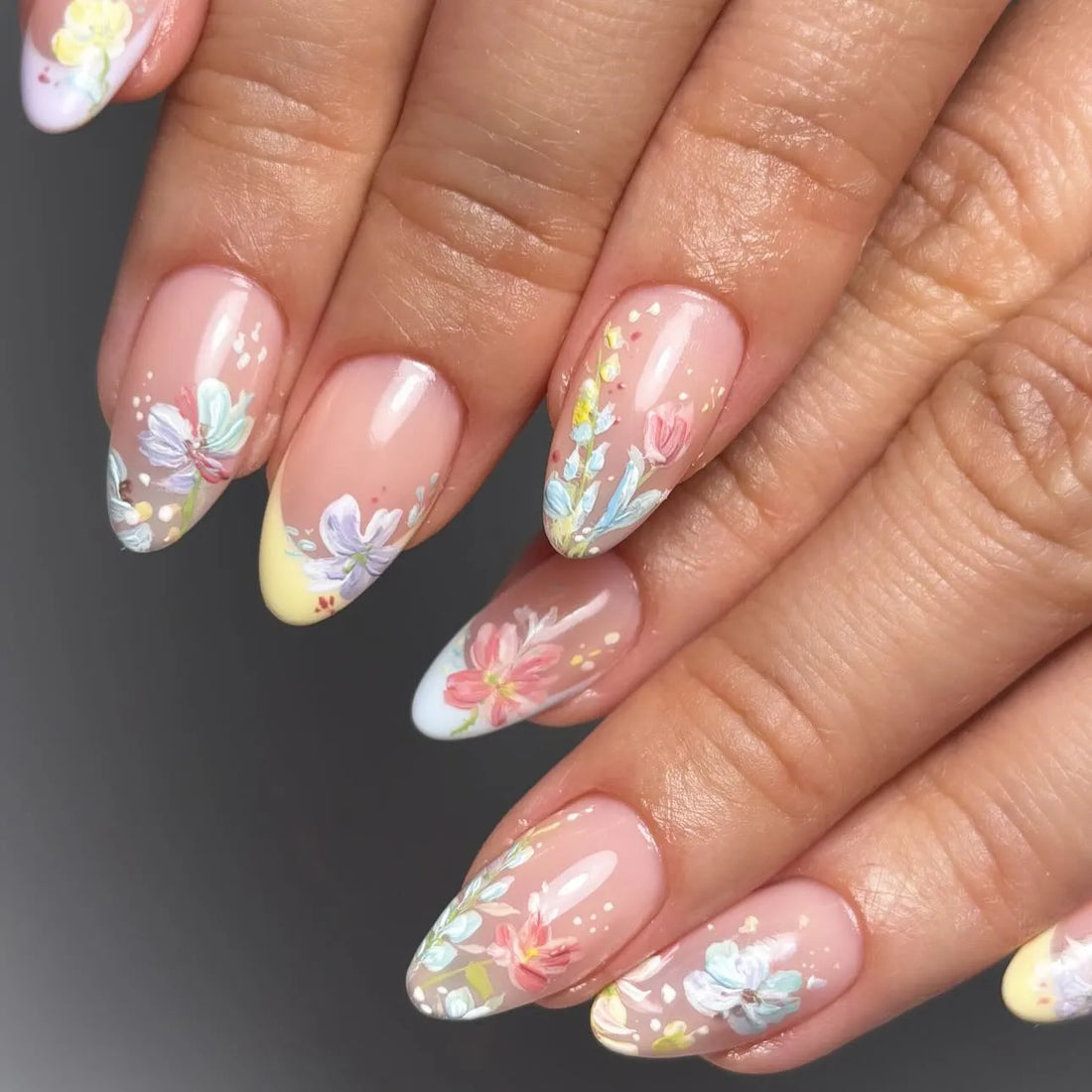 Handmade pastel floral French tip press-on nails with spring watercolor garden design.