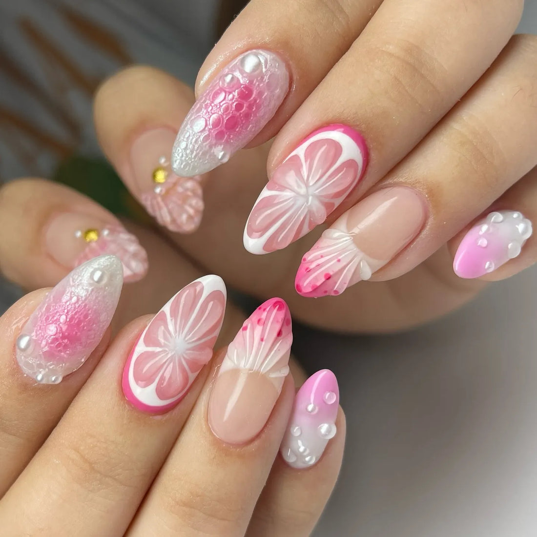 Handmade pink 3D citrus blossom press-on nails with pearl and floral designs