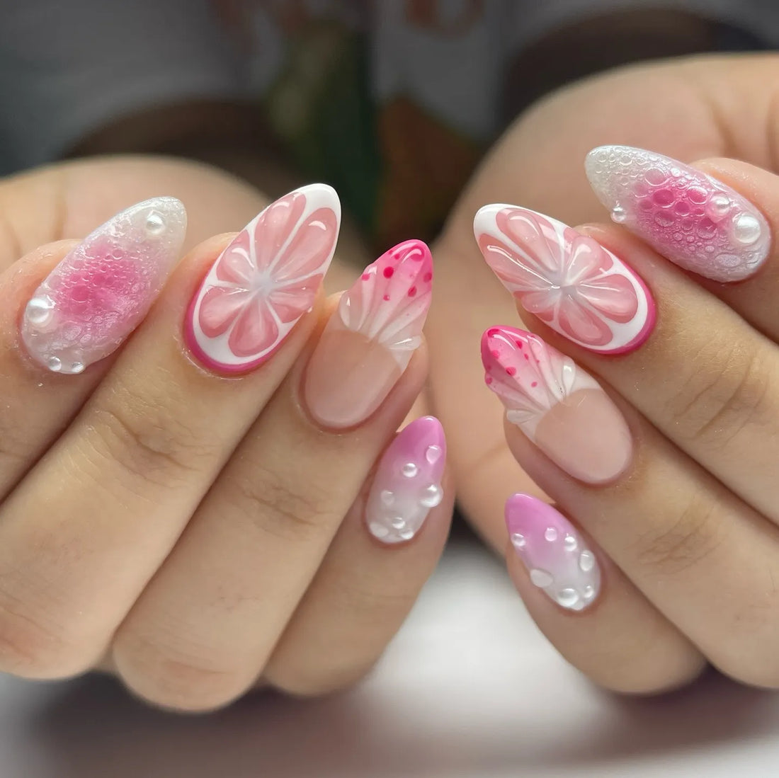 Handmade pink 3D citrus blossom press-on nails with pearl and floral designs