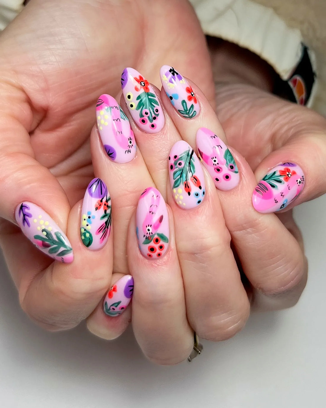Handmade pink press-on nails with abstract garden floral and berries art design