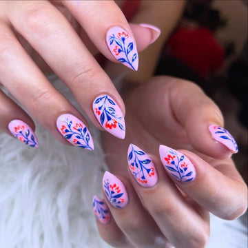 Handmade press-on nails with pink, blue, and red folk floral hand-painted designs