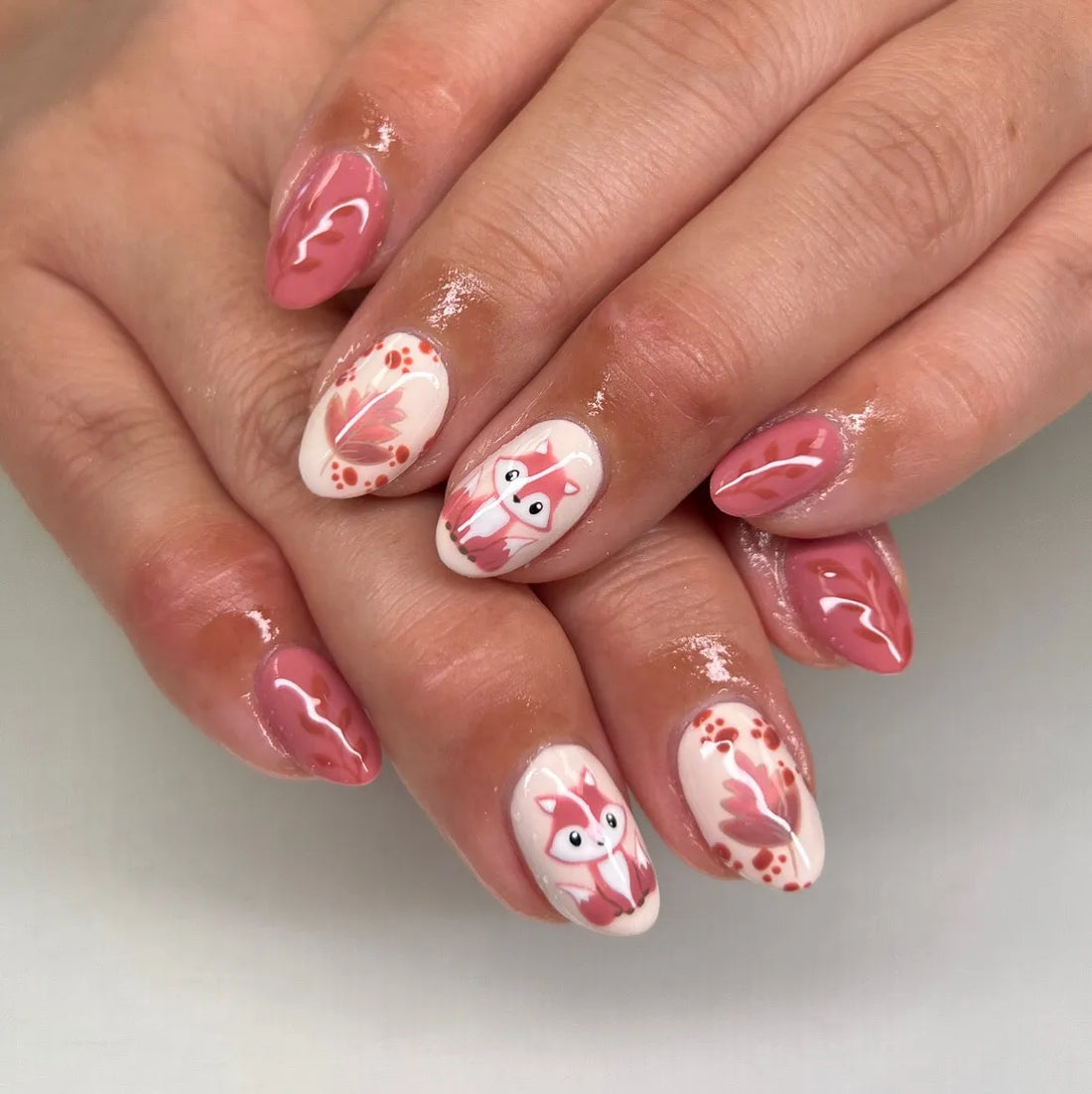 Handmade pink press-on nails with fox and autumn leaves nail art design