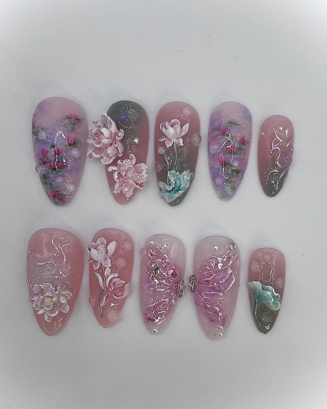 Handmade press-on nails with 3D pink and purple lotus flower and koi pond design