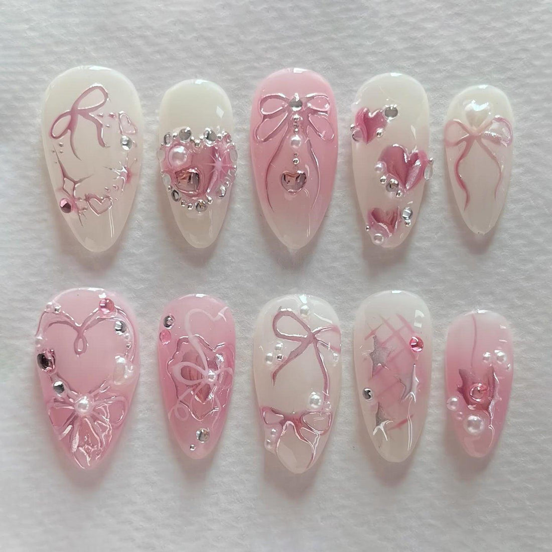 Handmade pink ribbon and pearl heart glossy press-on nails with romantic 3D designs