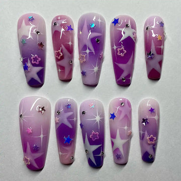 Handmade press-on nails with purple pink galaxy gradient, star and sparkle accents