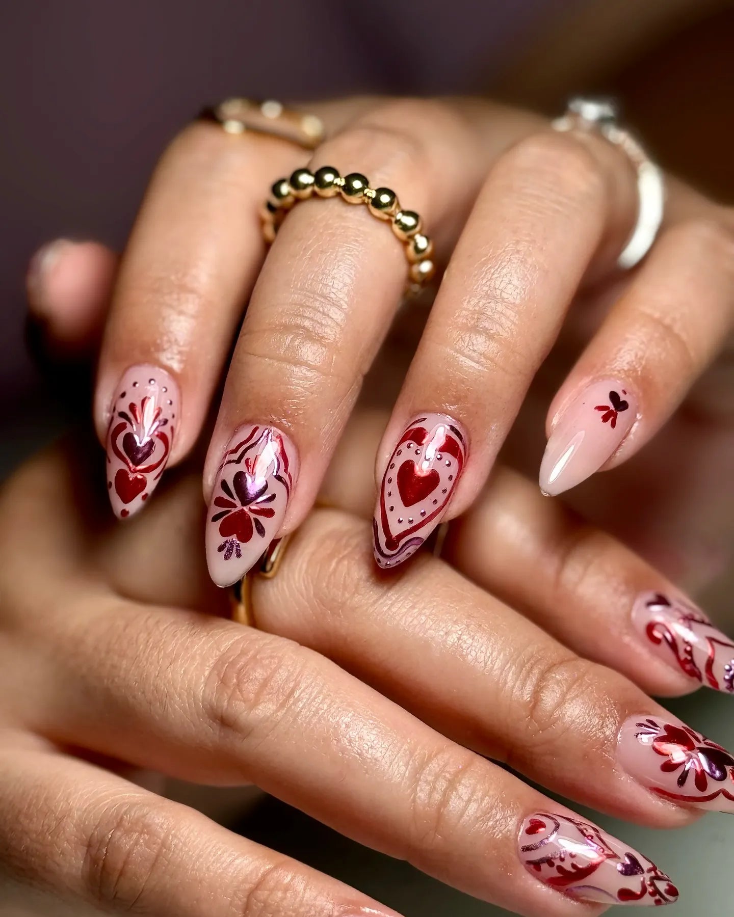 Handmade pink press-on nails with red chrome heart and floral folk art designs, Valentine theme