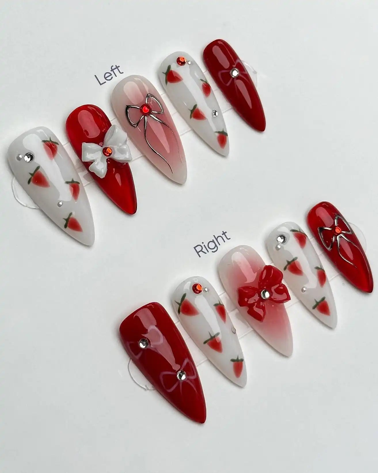 Handmade red and white press-on nails with strawberry, bow, and jewel accents, summer design