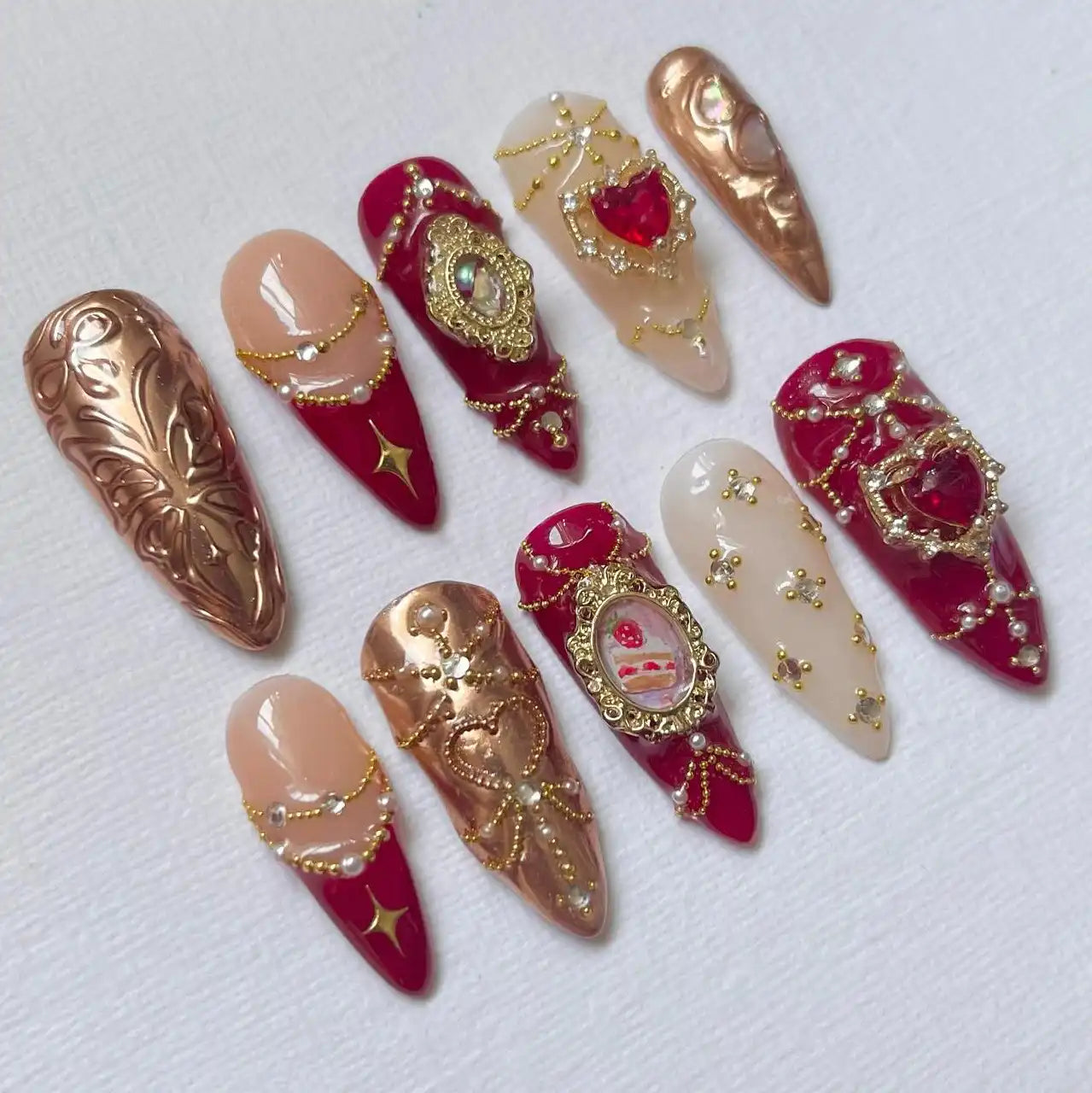 Handmade red and gold baroque press-on nails with pearls and ornate embellishments
