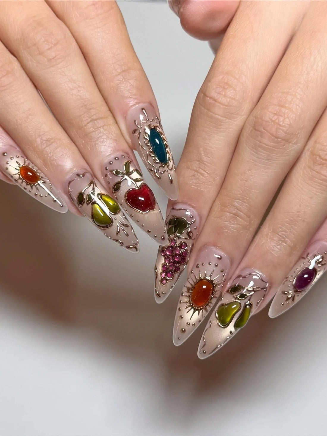 Handmade stiletto press-on nails with gemstone fruit and gold filigree 3D nail art