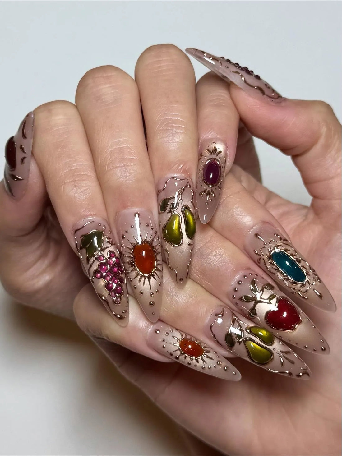Handmade stiletto press-on nails with gemstone fruit and gold filigree 3D nail art