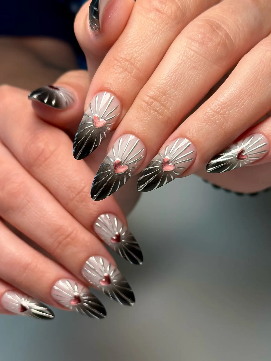 Handmade chrome sunburst press-on nails with pink heart 3D charms and ombre tips