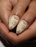 Handmade nude press-on nails with gold ornate floral folk art design