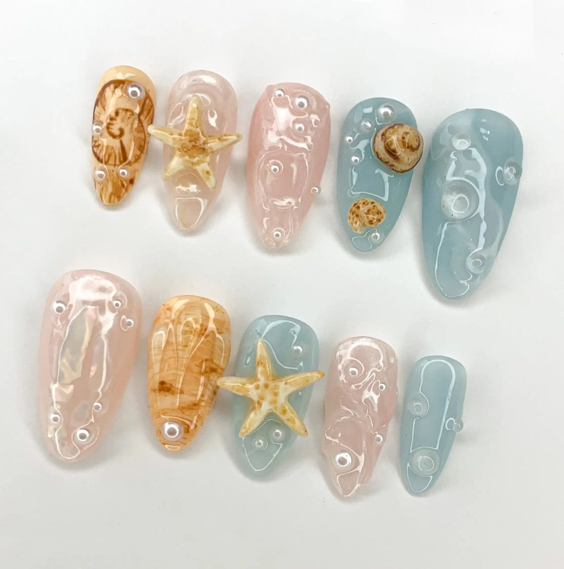 Handmade press-on nails with blue, nude, 3D seashells and starfish beachcore summer design
