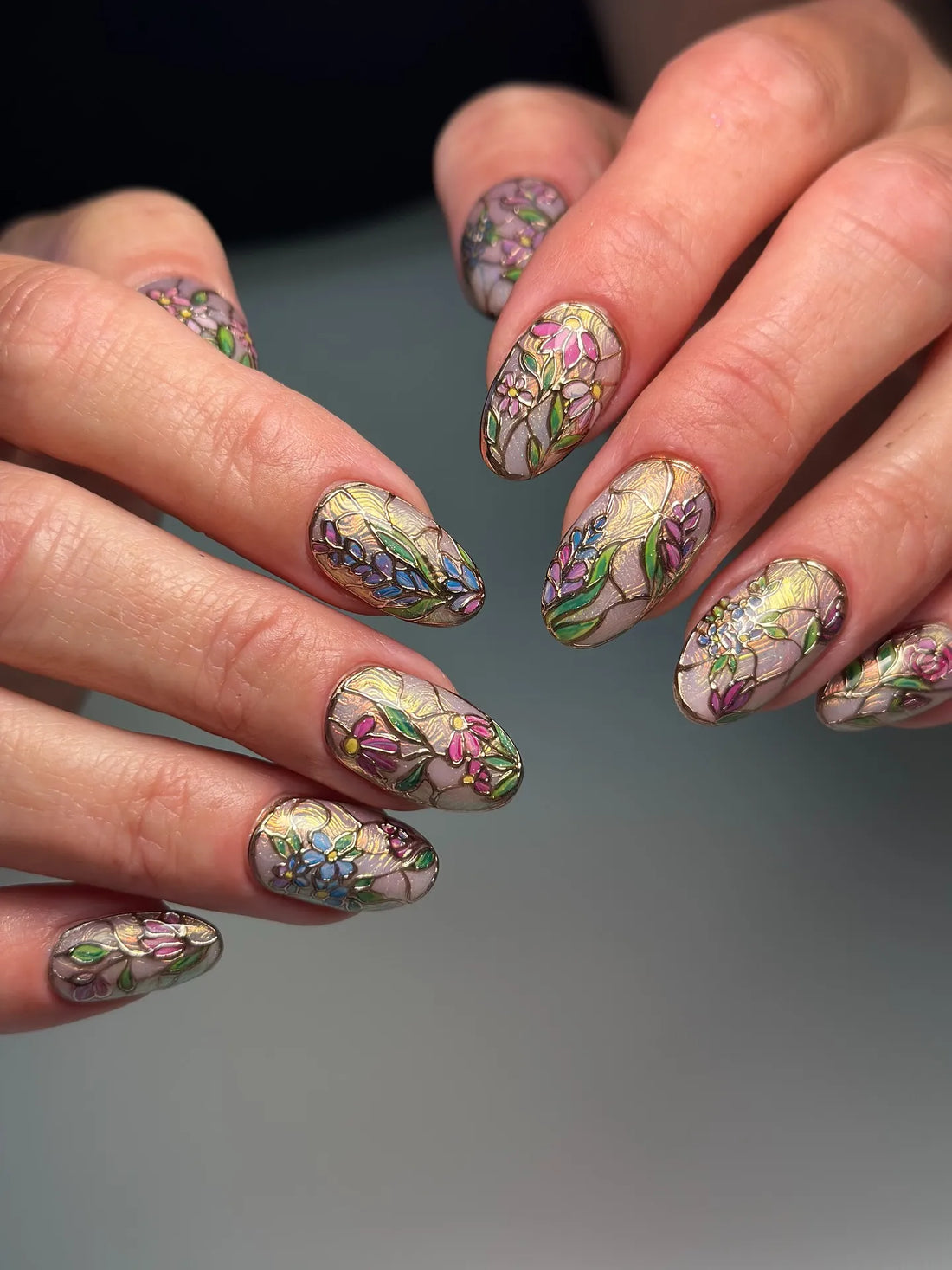 Handmade stained glass floral press-on nails with colorful intricate flower designs