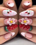 Handmade press-on nails with pink French tips, 3D strawberries, flowers, and gingham accents.