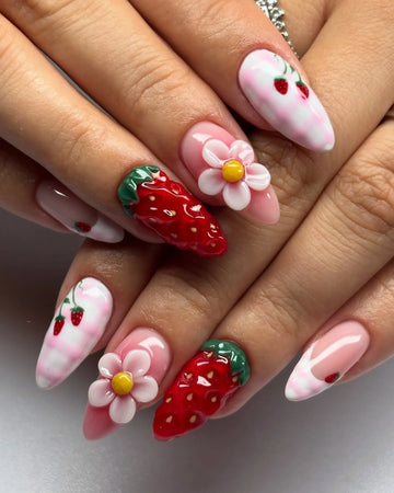 Handmade press-on nails with 3D strawberry, floral, and pink French tip kawaii art designs.