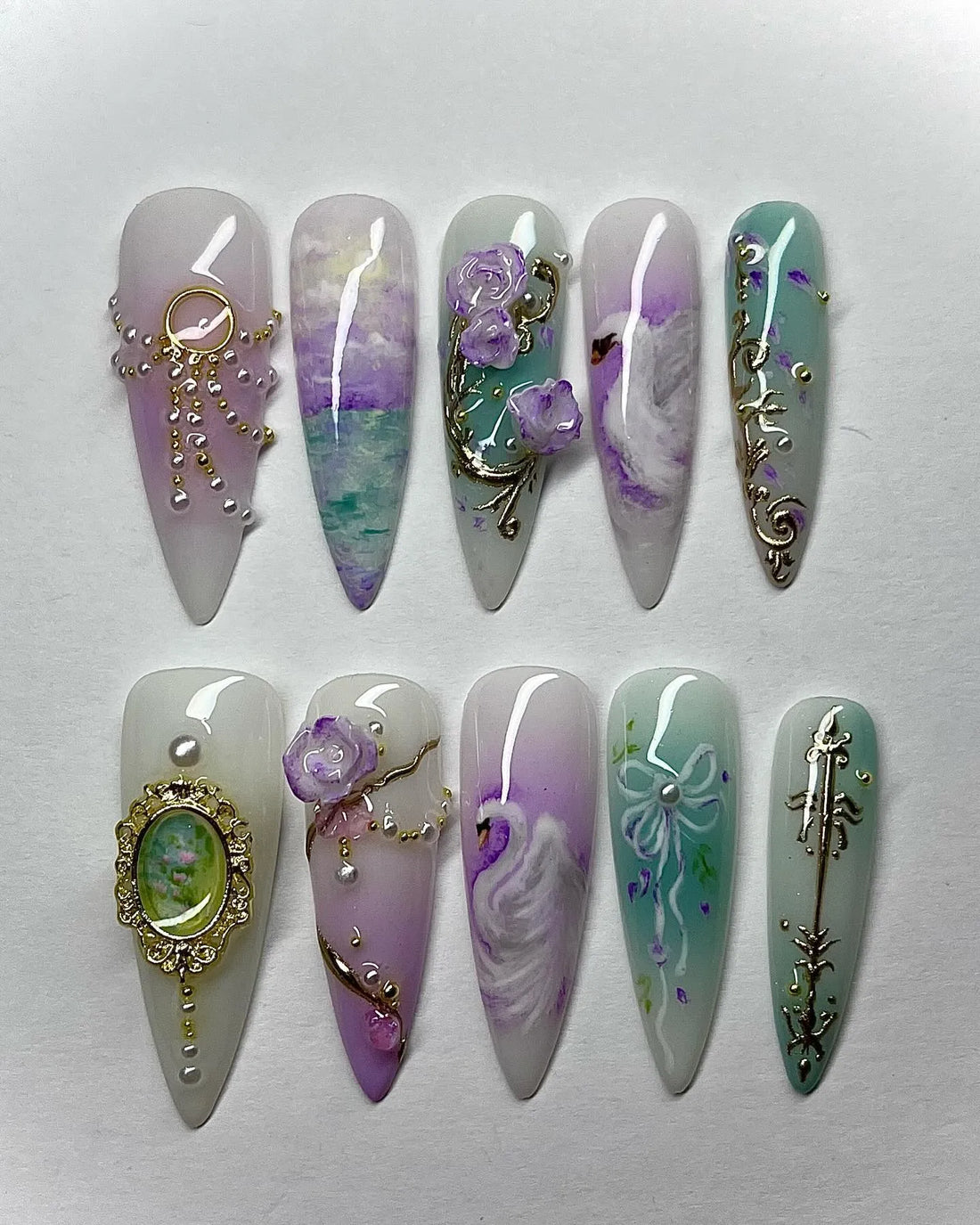 Handmade press-on nails with vintage scrollwork, swan, purple and aqua floral designs