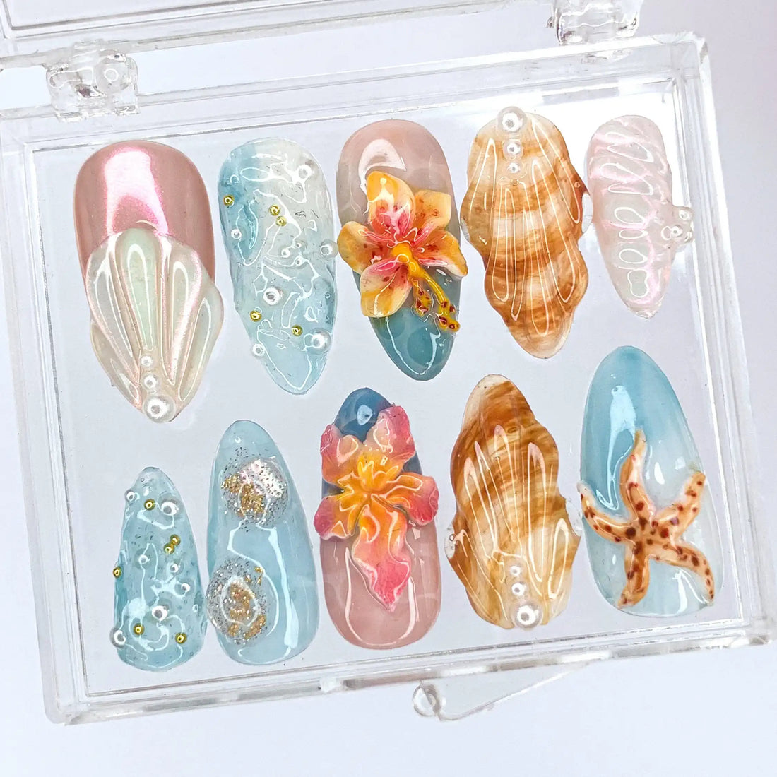 Handmade tropical press-on nails with starfish, seashell, flower accents and glitter ocean design